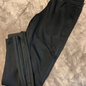 Gently loved black Adidas track pants.